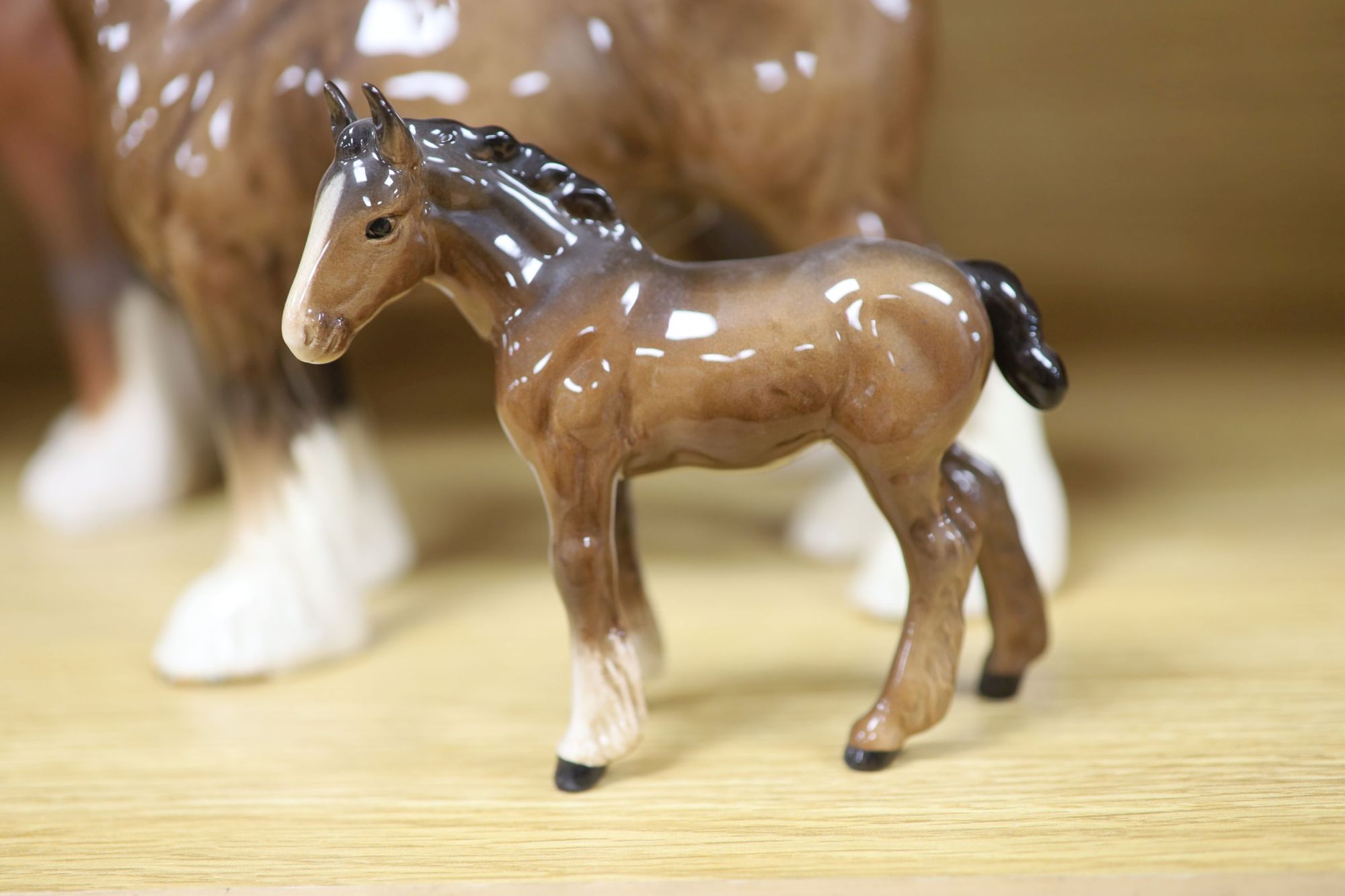 Five Beswick shire horses and a foal